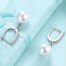 Load image into Gallery viewer, White Swarovski Elements Thin Dangling Freshwater Pearl Clip On Earrings in 14K White Gold Plating