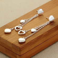 Load image into Gallery viewer, Long Dangling Heart Earrings in White Gold
